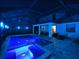 Enclosed pool and spa with lighting and seating area at 10916 Copperlefe Dr, Bradenton, FL 34212
