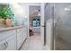 Bathroom with double vanity, shower, and view of bedroom at 11728 Meadowgate Pl, Bradenton, FL 34211