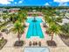 Resort-style lap pool with surrounding lounge area at 11728 Meadowgate Pl, Bradenton, FL 34211