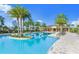 Large community pool with plenty of lounge chairs at 11728 Meadowgate Pl, Bradenton, FL 34211