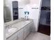 Double vanity bathroom with granite countertops at 11992 Blazing Star Dr, Venice, FL 34293