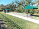 Well-maintained bocce ball court with shaded seating areas at 11992 Blazing Star Dr, Venice, FL 34293