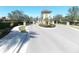 Gated entrance to a community with lush landscaping at 11992 Blazing Star Dr, Venice, FL 34293