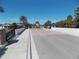 Gated entrance with a bridge and palm trees at 11992 Blazing Star Dr, Venice, FL 34293