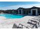 Inviting community pool area with plenty of lounge chairs at 11992 Blazing Star Dr, Venice, FL 34293