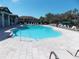 Resort-style community pool with ample lounge chairs at 11992 Blazing Star Dr, Venice, FL 34293