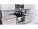 Modern kitchen with granite countertops and stainless steel appliances at 11992 Blazing Star Dr, Venice, FL 34293