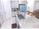 Kitchen with granite countertops and light-colored cabinets at 11992 Blazing Star Dr, Venice, FL 34293