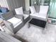 Patio furniture set with gray wicker chairs at 11992 Blazing Star Dr, Venice, FL 34293