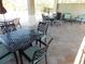 Community patio with tables and chairs for relaxing at 11992 Blazing Star Dr, Venice, FL 34293