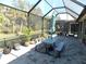 Spacious screened patio, perfect for outdoor dining and relaxing at 11992 Blazing Star Dr, Venice, FL 34293