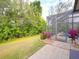 Screened pool and patio area, lush landscaping at 12338 Lavender Loop, Bradenton, FL 34212