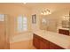 Bathroom with shower, tub, and double vanity at 12338 Lavender Loop, Bradenton, FL 34212