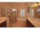 Bathroom with shower, tub, and double vanity at 12338 Lavender Loop, Bradenton, FL 34212