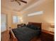 Bedroom with a sleigh bed, sitting area, and ceiling fan at 12338 Lavender Loop, Bradenton, FL 34212