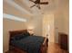 Bedroom with sleigh bed, ceiling fan, and ensuite bathroom at 12338 Lavender Loop, Bradenton, FL 34212