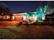 Night view of home exterior with landscaping at 12338 Lavender Loop, Bradenton, FL 34212