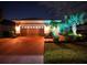 Night view of home exterior, well-lit at 12338 Lavender Loop, Bradenton, FL 34212