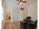 Home office with wood floors, desk and en-suite bathroom at 12338 Lavender Loop, Bradenton, FL 34212
