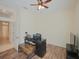 Home office with wood floors, desk and TV at 12338 Lavender Loop, Bradenton, FL 34212