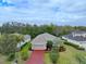 Single-story home with a red driveway at 12338 Lavender Loop, Bradenton, FL 34212