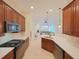 Kitchen with island and stainless steel appliances at 12338 Lavender Loop, Bradenton, FL 34212