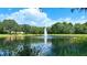 Serene lake view with fountain and lush greenery at 12338 Lavender Loop, Bradenton, FL 34212