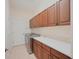 Laundry room with washer, dryer, and cabinets at 12338 Lavender Loop, Bradenton, FL 34212