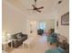 Open living area with seating and view to bar area at 12338 Lavender Loop, Bradenton, FL 34212