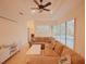 Spacious living room with sectional sofa and pool view at 12338 Lavender Loop, Bradenton, FL 34212