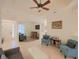 Open living area with seating and view to bar area at 12338 Lavender Loop, Bradenton, FL 34212