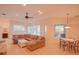 Open living area with large sectional sofa, and views of the pool and patio at 12338 Lavender Loop, Bradenton, FL 34212
