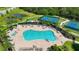 Community lap pool with a surrounding patio and lounge chairs at 12338 Lavender Loop, Bradenton, FL 34212