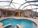 Large, kidney-shaped pool with spa and screened enclosure at 12338 Lavender Loop, Bradenton, FL 34212