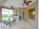 Relaxing screened patio with table and chairs, perfect for outdoor dining at 12338 Lavender Loop, Bradenton, FL 34212