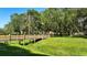 Wooden footbridge over a tranquil waterway at 12338 Lavender Loop, Bradenton, FL 34212