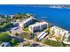 A stunning bird's eye view of a waterfront condominium complex with lush landscaping and a glimpse of the marina at 1600 1St W Ave # 304A, Bradenton, FL 34205