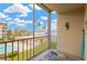 Balcony with stunning views of the pool, palm trees, and waterfront at 1600 1St W Ave # 304A, Bradenton, FL 34205