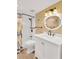 Well-lit bathroom with modern white vanity, neutral colored walls, tub and shower at 1600 1St W Ave # 304A, Bradenton, FL 34205