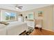 Bright bedroom with a large window, ceiling fan, and dresser with ample storage at 1600 1St W Ave # 304A, Bradenton, FL 34205