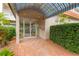 Welcoming entrance features a covered awning and well-maintained brick path at 1600 1St W Ave # 304A, Bradenton, FL 34205