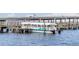 A covered Gulf Island Ferry boat sits at a dock ready to receive passengers at 1600 1St W Ave # 304A, Bradenton, FL 34205