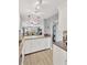 Modern kitchen with granite countertops, white cabinets, open to the living area with stylish pendant lighting at 1600 1St W Ave # 304A, Bradenton, FL 34205