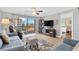 Cozy living room boasts lots of natural light and comfortable seating at 1600 1St W Ave # 304A, Bradenton, FL 34205