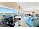 Bright living room with tile flooring and an impressive water view, showcasing indoor-outdoor living at 1600 1St W Ave # 304A, Bradenton, FL 34205