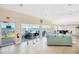 Bright living room with tile flooring and great water views, showcasing indoor-outdoor living at 1600 1St W Ave # 304A, Bradenton, FL 34205