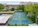 Aerial view of well-maintained pickleball courts within a fenced-in recreation area at 1600 1St W Ave # 304A, Bradenton, FL 34205