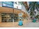 Exterior view of a shopping center with a brightly lit storefront and large advertising display at 1600 1St W Ave # 304A, Bradenton, FL 34205
