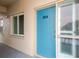 Condo unit entrance with blue door and frosted glass window at 1600 1St W Ave # 304A, Bradenton, FL 34205