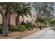 A landscaped walkway sits in front of a low rise condominium community at 1600 1St W Ave # 304A, Bradenton, FL 34205